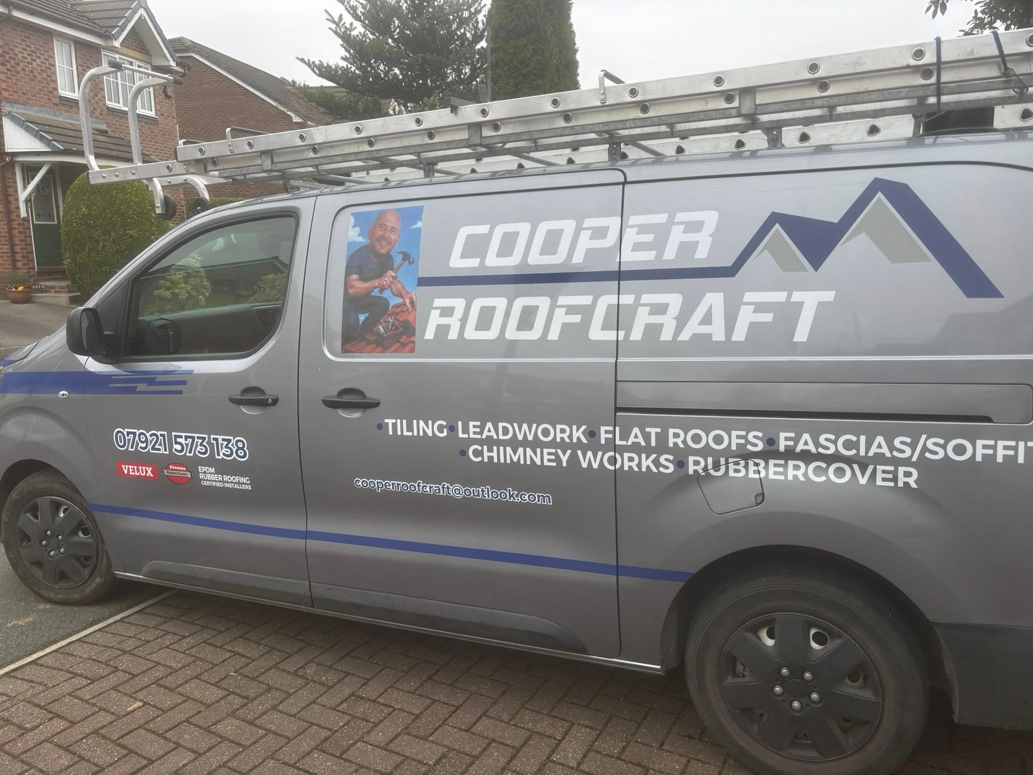 Cooper Roofcraft sign-written van with company branding and contact details