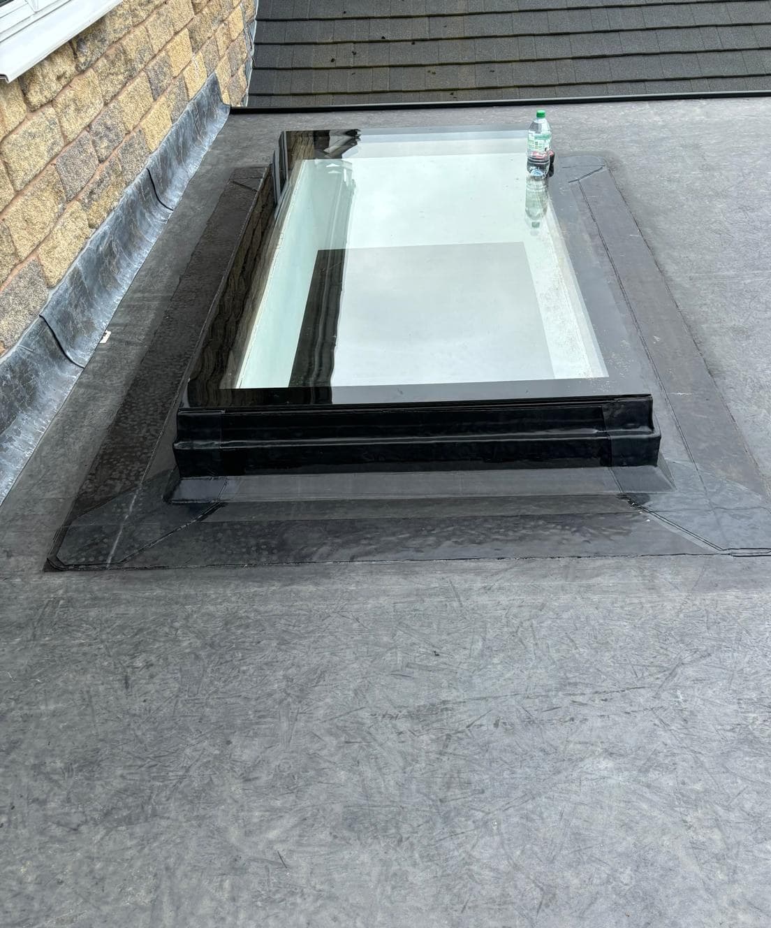 Flat roof installation with rooflight by Cooper Roofcraft